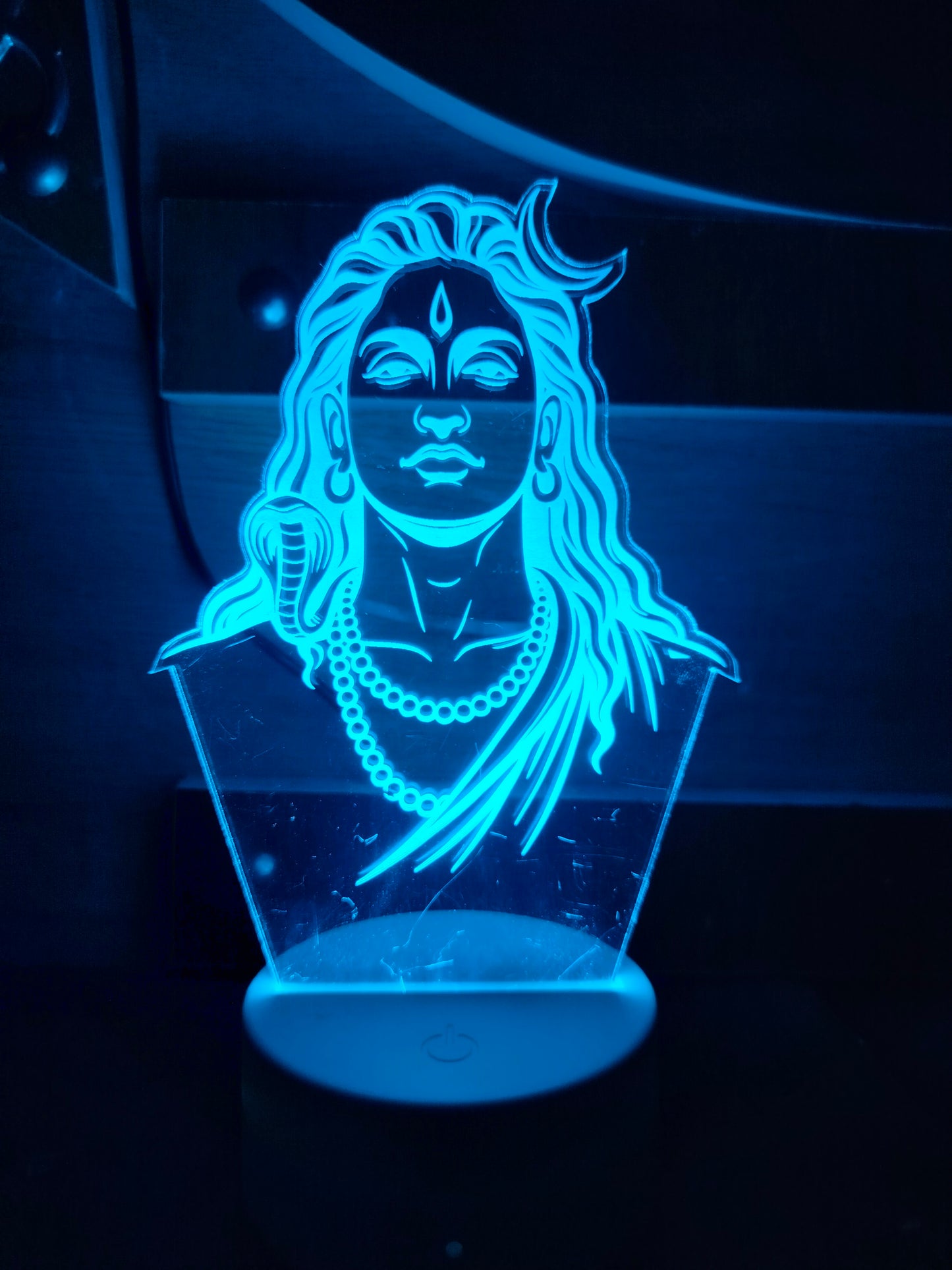 Adiyogi LED lamp used as spiritual décor
Spiritual home setup with Adiyogi 3D light
LED night light of Adiyogi in bedroom corner
Peaceful décor with Adiyogi night lamp