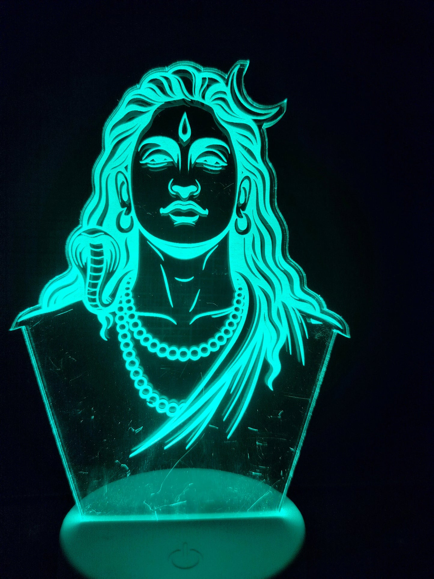 Adiyogi 3D LED lamp glowing red
Color-changing LED night lamp of Adiyogi
Red LED glow of Adiyogi acrylic panel
Spiritual Adiyogi lamp in blue light mode