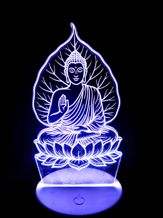 Side view of acrylic Buddha lamp under peepal tree
Meditating Buddha 3D LED light viewed from angle
Tree and Buddha pose from side in illusion lamp
Spiritual LED lamp of Buddha and sacred tree from side