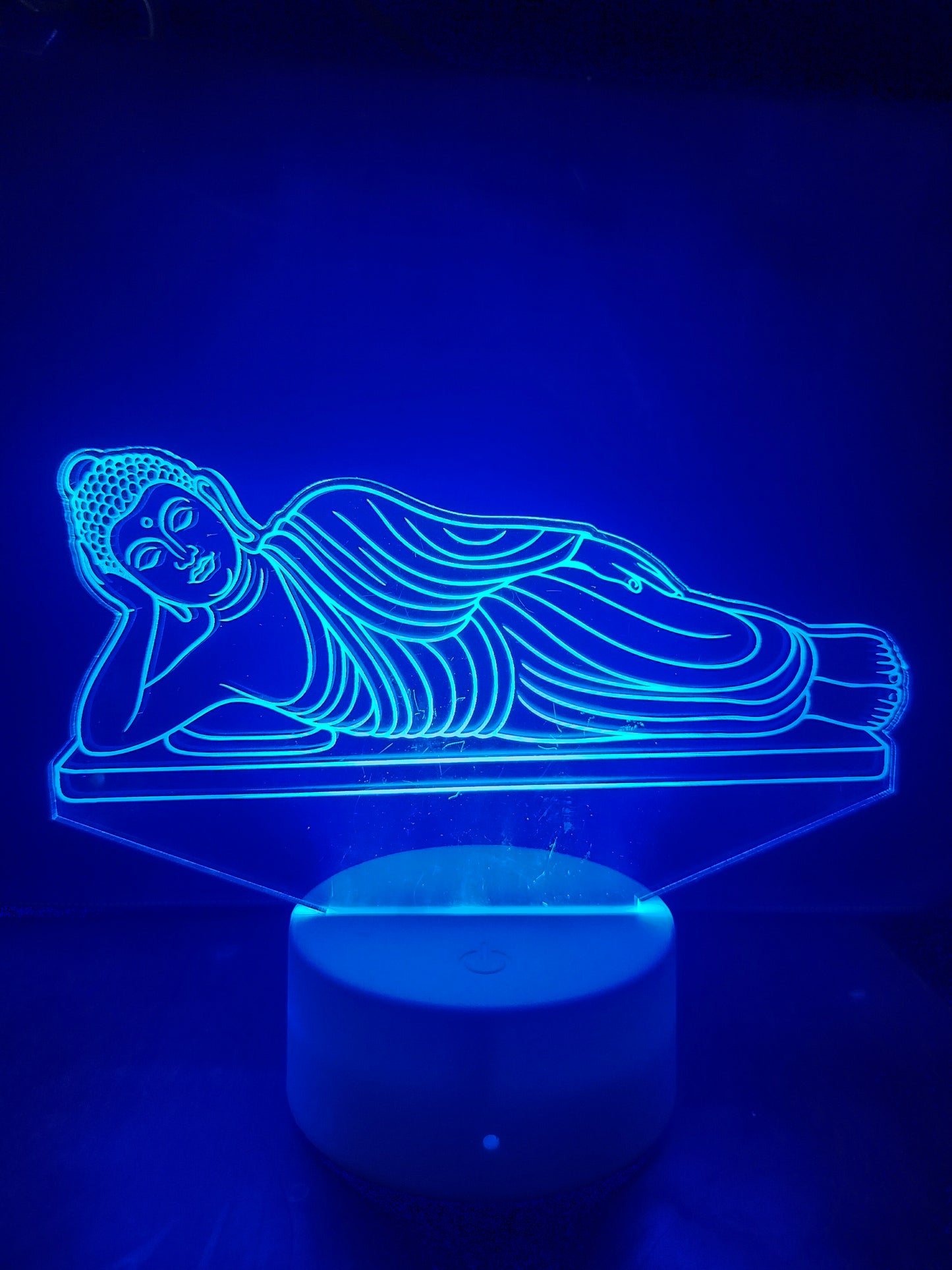 Color changing Reclining Buddha LED lamp display
Buddha lamp with red, green, and blue lighting modes
Reclining Buddha illusion lamp in various colors
3D LED spiritual light with multicolor glow effect