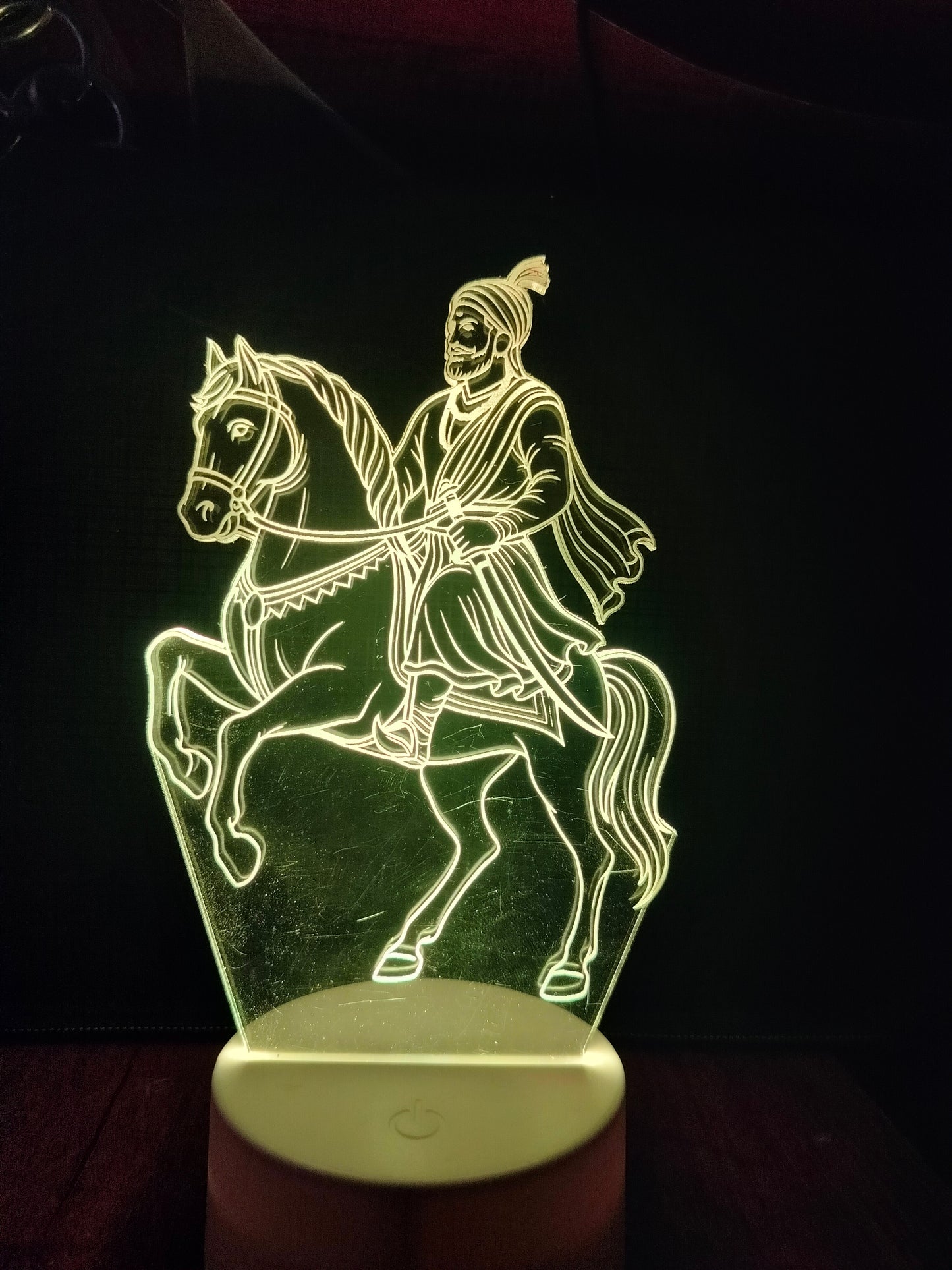 Shivaji Maharaj lamp in natural daylight
Acrylic LED light of Shivaji during day
Unlit Shivaji Maharaj lamp on desk
Clear acrylic horse rider lamp in sunlight