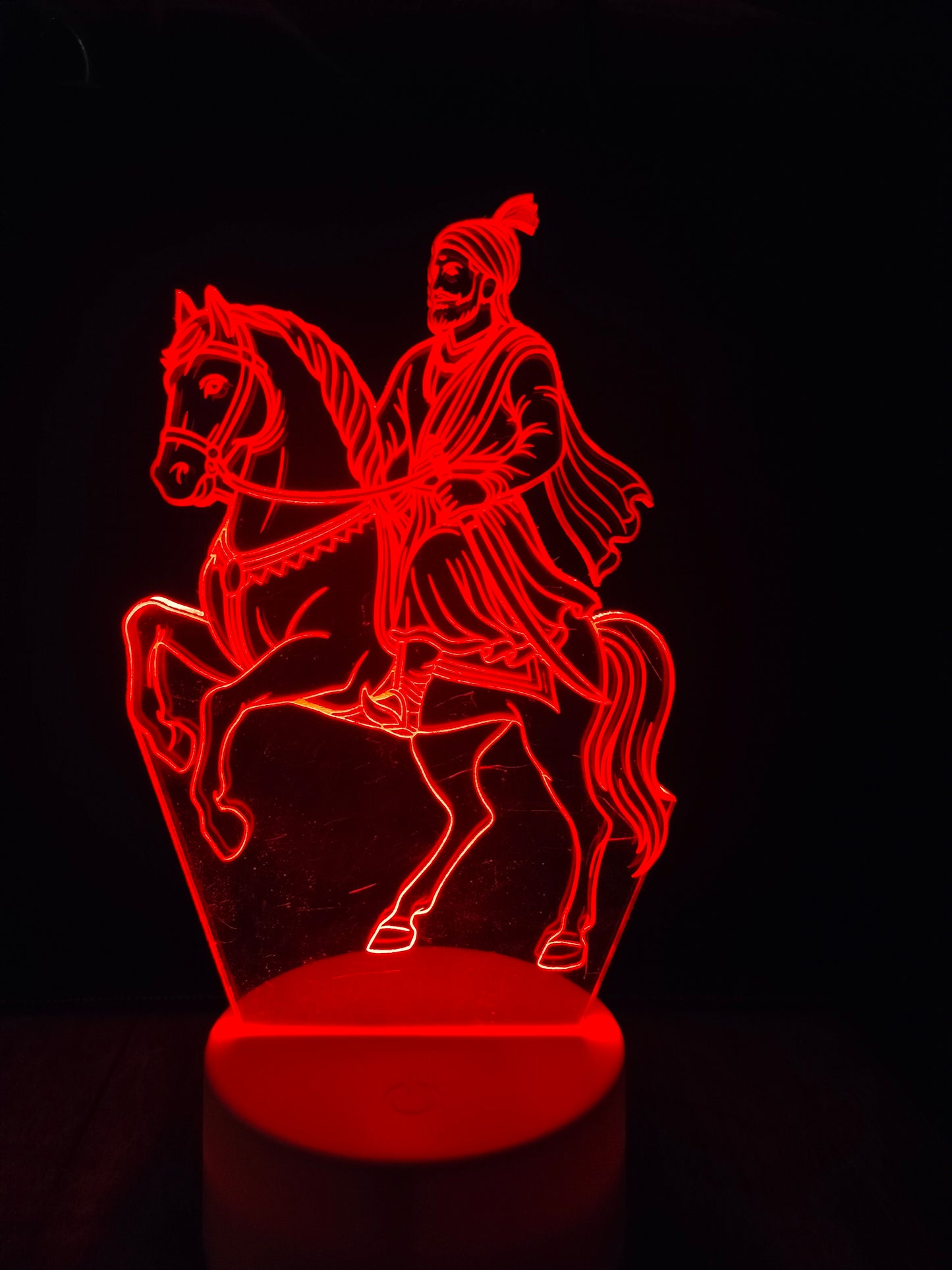 Shivaji Maharaj night lamp on wooden table
Home decor lamp featuring Shivaji Maharaj on horse
Glowing Shivaji LED lamp on shelf
LED night light of Indian warrior king
