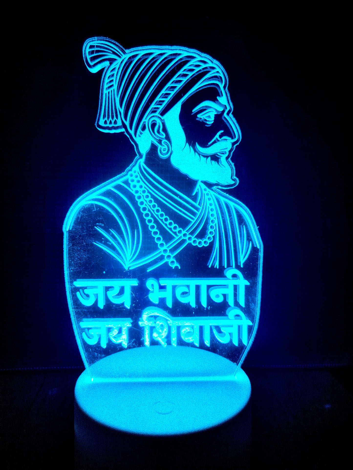 Shivaji Maharaj portrait lamp glowing in red light
LED lamp of Shivaji Maharaj in multiple color modes
Multicolor glow effect of Shivaji Maharaj acrylic lamp
Color-changing LED portrait of Shivaji Maharaj