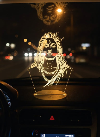 "Warm yellow LED 3D illusion light of Lord Shiva (Mahadev) on a car dashboard during night driving"
yellow LED light, Lord Shiva Mahadev, 3D illusion, car dashboard decor.
"Amber glowing Mahadev Shiva idol on a car dashboard, providing a sense of spiritual calm and safety during night travel"
Mahadev Shiva idol, car dashboard, spiritual calm, night travel safety.