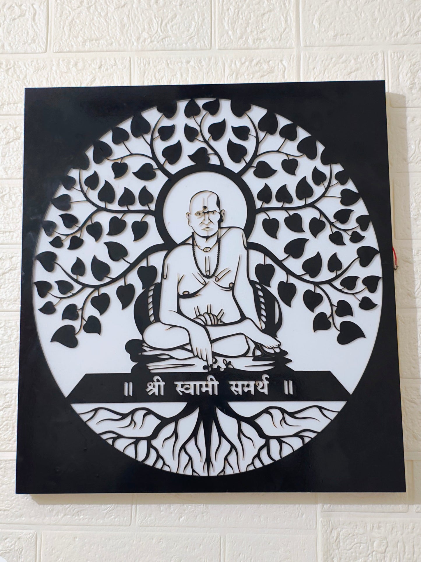 Artistic depiction of a seated figure with tree-like design on a black 
background
Home temple LED wall hanging of Swami Samarth
Swami Samarth spiritual lighting décor for home
Acrylic black laser cut LED spiritual wall frame
Swami Samarth pooja room backlit wall art
Handmade spiritual LED hanging frame India
Glow X Art Swami Samarth premium wall light
Housewarming gift Swami Samarth LED frame
