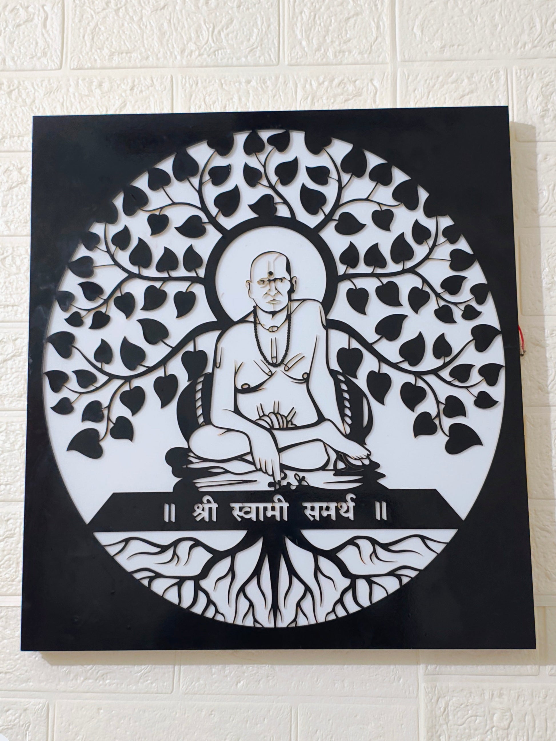 Artistic depiction of a seated figure with tree-like design on a black 
background
Home temple LED wall hanging of Swami Samarth
Swami Samarth spiritual lighting décor for home
Acrylic black laser cut LED spiritual wall frame
Swami Samarth pooja room backlit wall art
Handmade spiritual LED hanging frame India
Glow X Art Swami Samarth premium wall light
Housewarming gift Swami Samarth LED frame