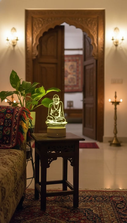 "Yellow LED 3D idol of Shri Swami Samarth on a dark wooden side table in a traditionally decorated living room"LED idol, Shri Swami Samarth, wooden side table, traditional decor.