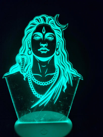 Adiyogi 3D LED lamp glowing red
Color-changing LED night lamp of Adiyogi
Red LED glow of Adiyogi acrylic panel
Spiritual Adiyogi lamp in blue light mode

