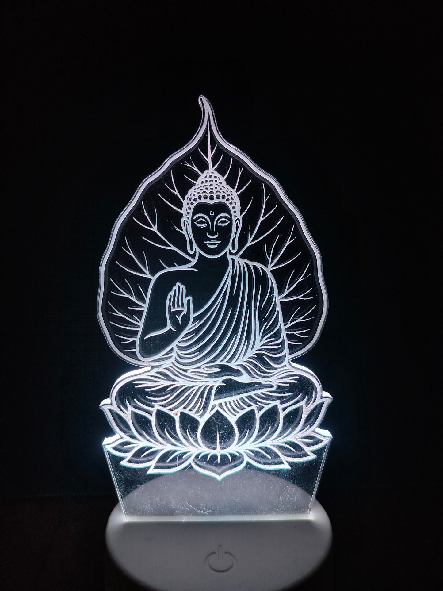 Zen decor setup with Gautam Buddha LED lamp

Meditation space with Buddha under tree light

Spiritual ambiance featuring 3D Buddha lamp

Peaceful LED light for home decor and wellness zone

