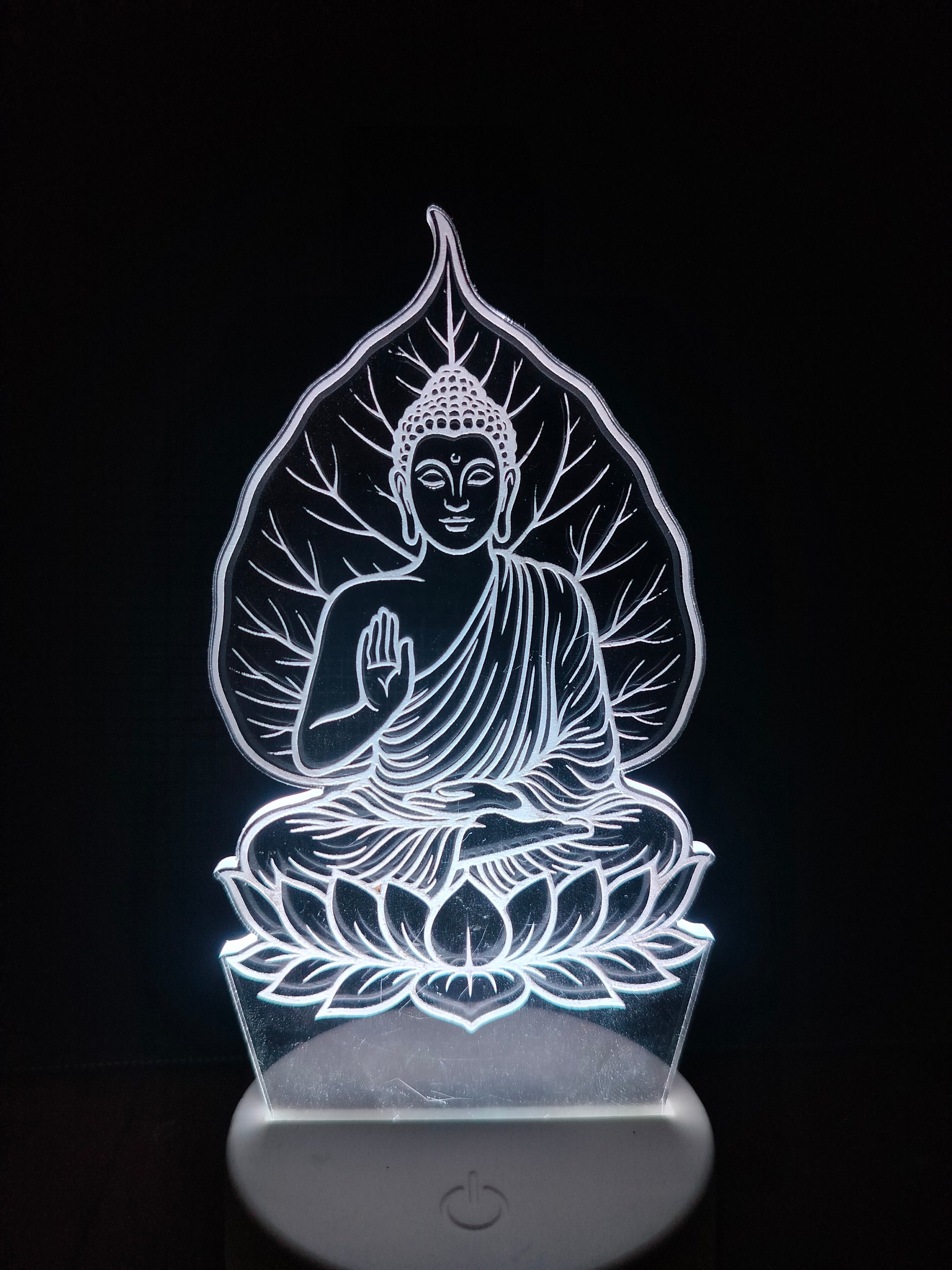 Zen decor setup with Gautam Buddha LED lamp

Meditation space with Buddha under tree light

Spiritual ambiance featuring 3D Buddha lamp

Peaceful LED light for home decor and wellness zone

