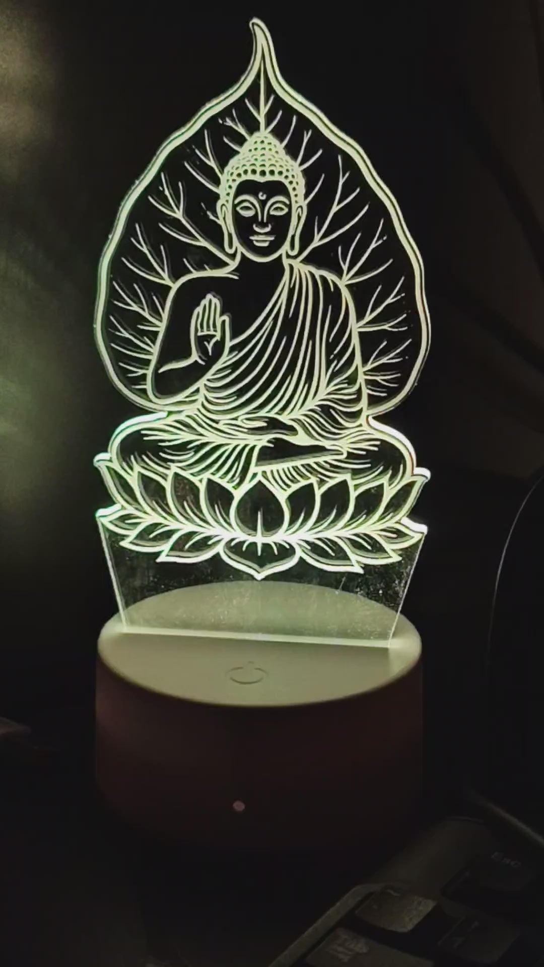 Gautam Buddha 3D Illusion LED lamp glowing softly with blue light by Glow X Art, perfect spiritual decor for meditation and home ambiance, detailed acrylic Buddha design illuminated with vibrant LED lighting, elegant night lamp ideal for gifting and creating peaceful atmosphere, Glow X Art’s unique Buddha lamp for yoga rooms, living spaces, and relaxation, artistic 3D glowing Buddha lamp video showcasing calming effects and intricate laser-cut design.